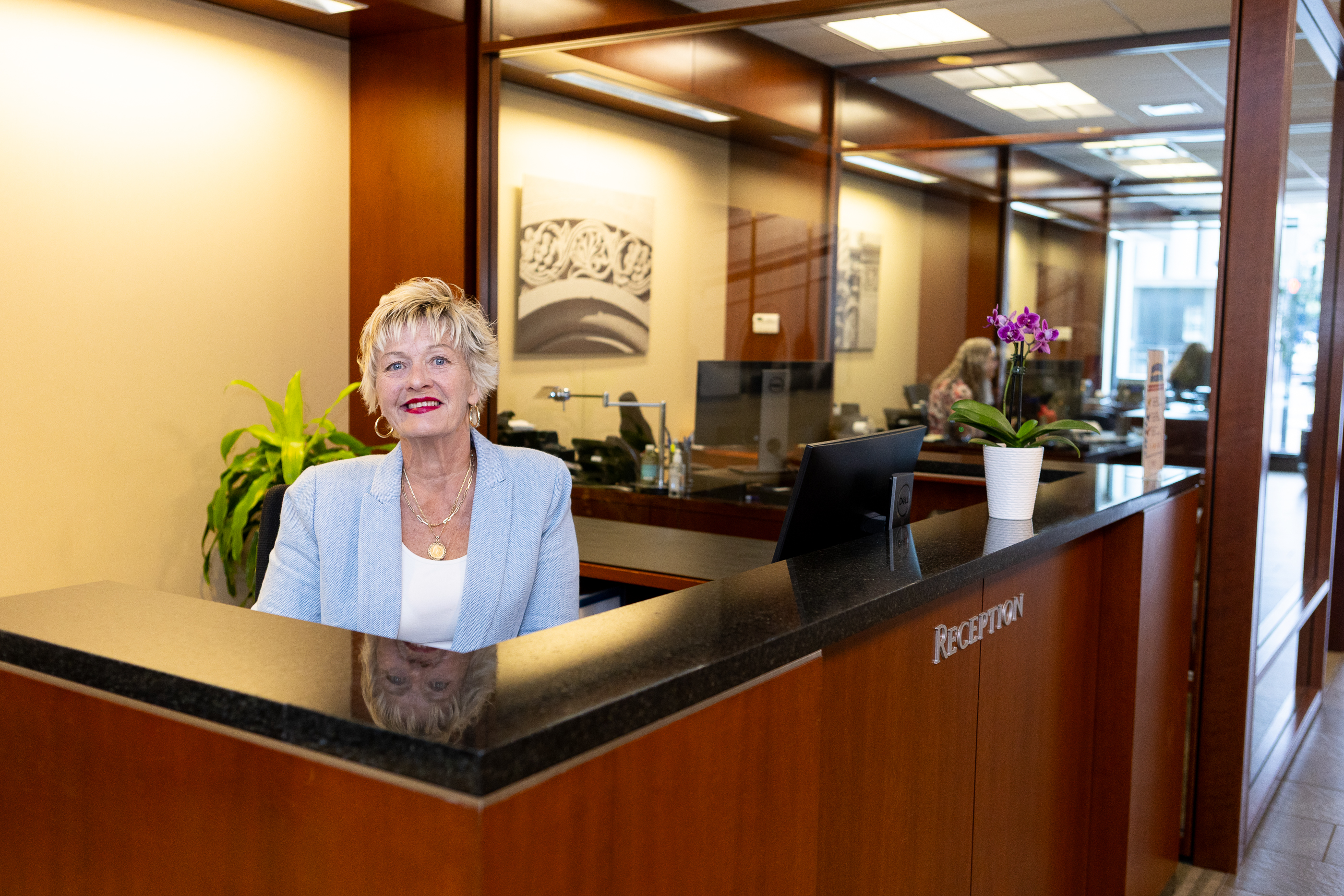 Receptionist at the Welcome Desk at the Main Office in Watertown.