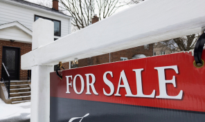 For sale sign in front of a house.