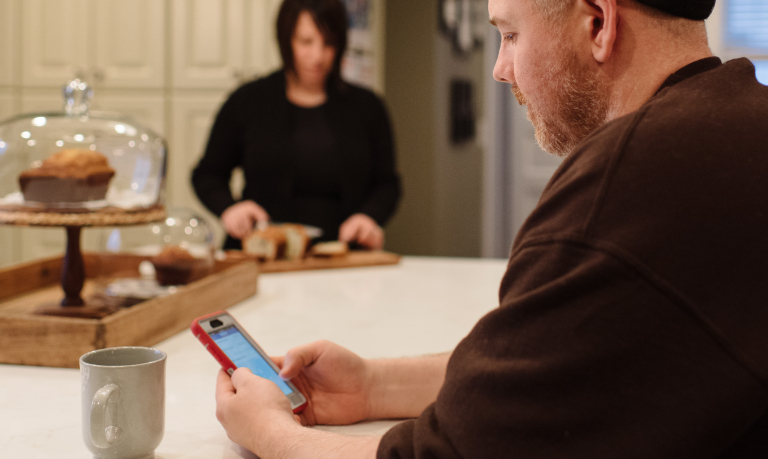 WSB Customer using his mobile banking app to check his accounts.