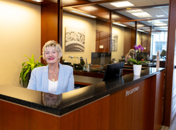 WSB employee at the Reception desk at the Main Office.