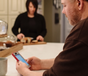 WSB Customer using his mobile banking app to check his accounts.