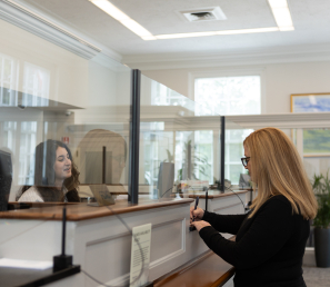 WSB Customer making a transaction at the teller line.