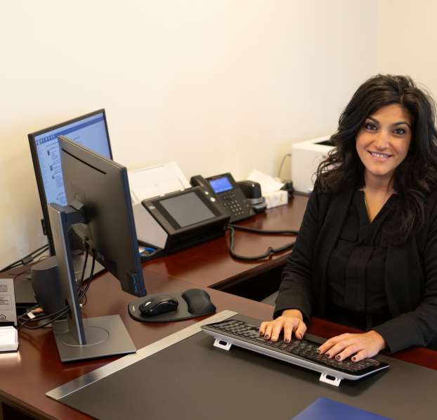 Loan Officer sitting at her desk.